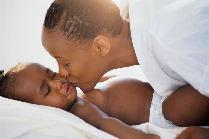 African American Mother Kissing Baby